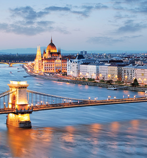 Chain Bridge lit up at night in Budapest, Hungary