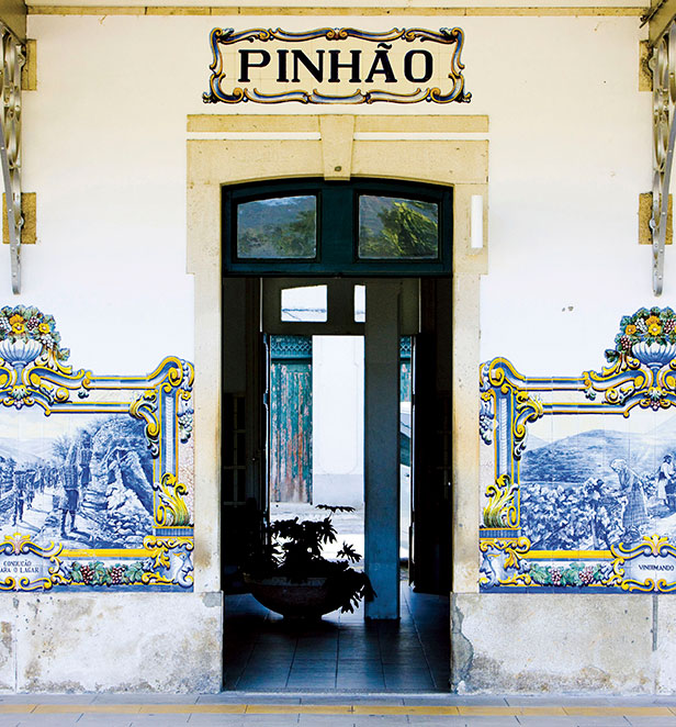 Blue and yellow tile murals on the wall of Pinhao railway station Portugal